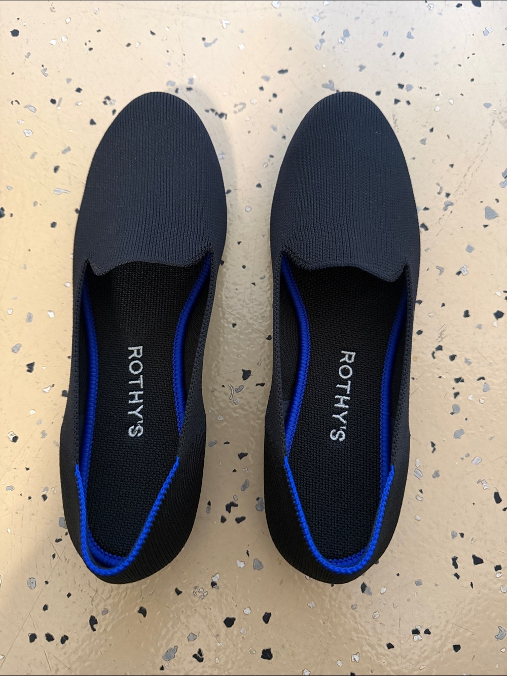 Rothy's Black Slip-On Loafers with Blue Accents